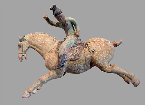 Statue of a woman riding a galloping horse