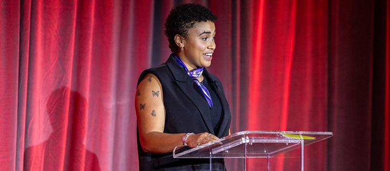 Valeriya Woodard ’25 speaks from a podium