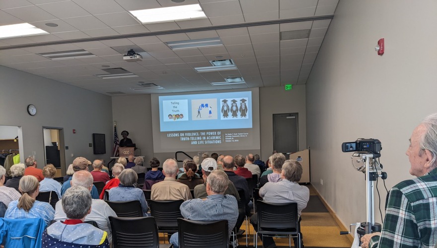 Kesho speaking at library event 