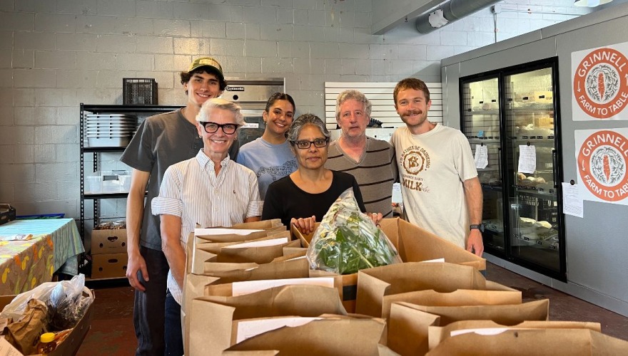 People at grinnell fram to table
