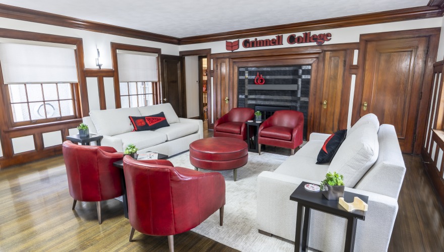 living room with fireplace and red chairs at 
