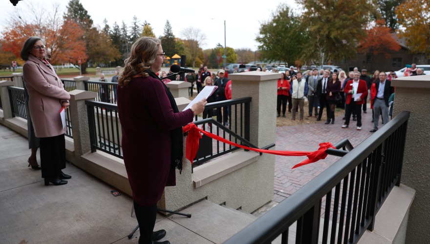 Rachel Bly talking to the crowd at ribbon cutting