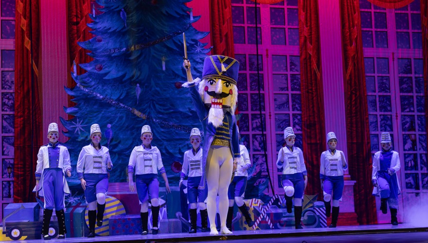 Nutcraker on stage with soilders behind
