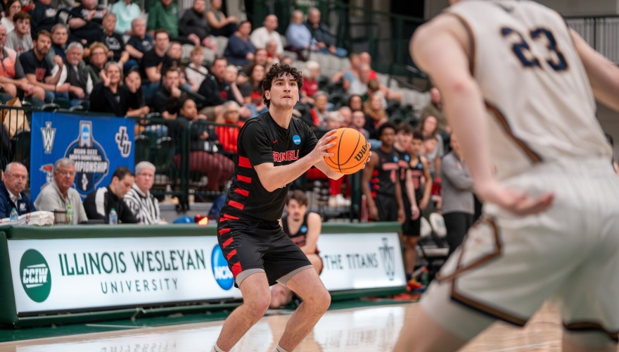 Men's basketball player prepares to shoot a three pointer
