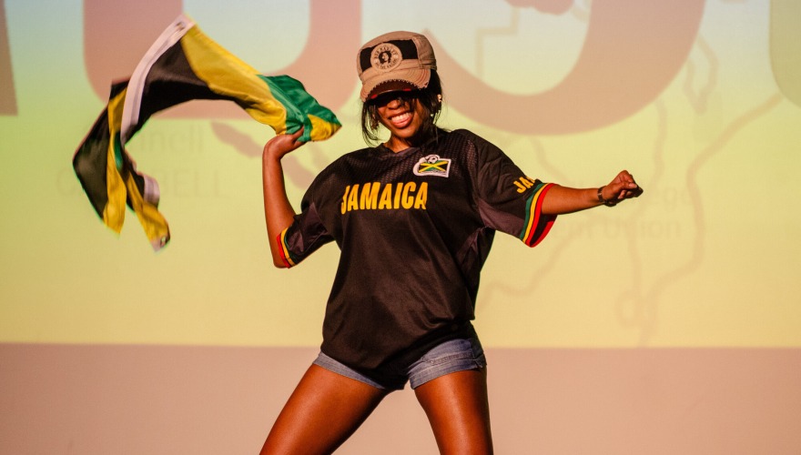 girl on stage with Jamaica Flag 