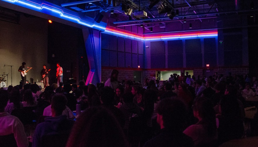 dark room with bands playing 