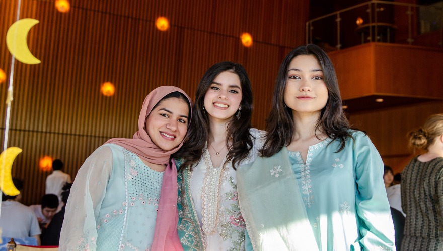 Three women standing 