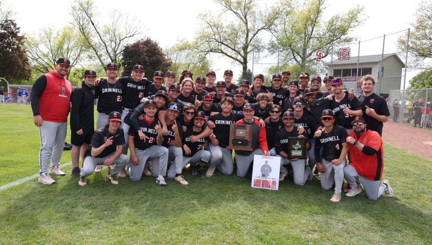 Group photo of the baseball team after winning the conference tournament.