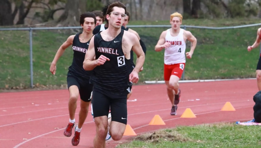 Runners racing on an outdoor track.