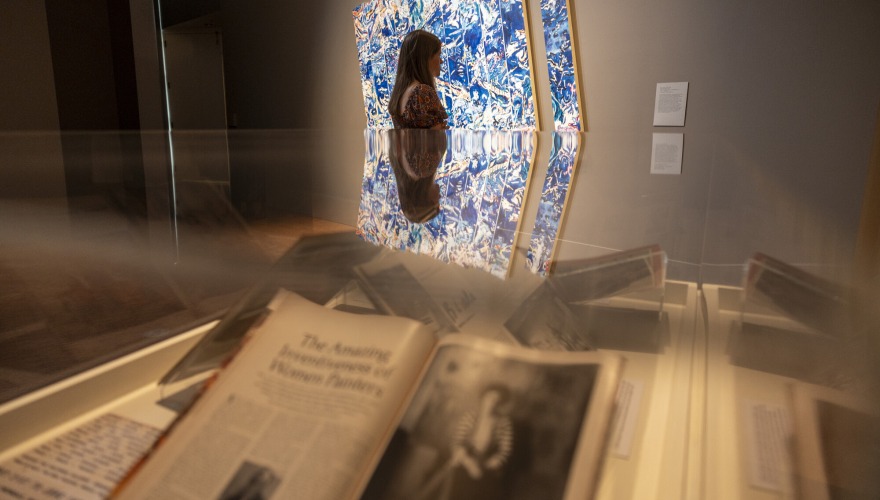 person in gallery and then book in distance