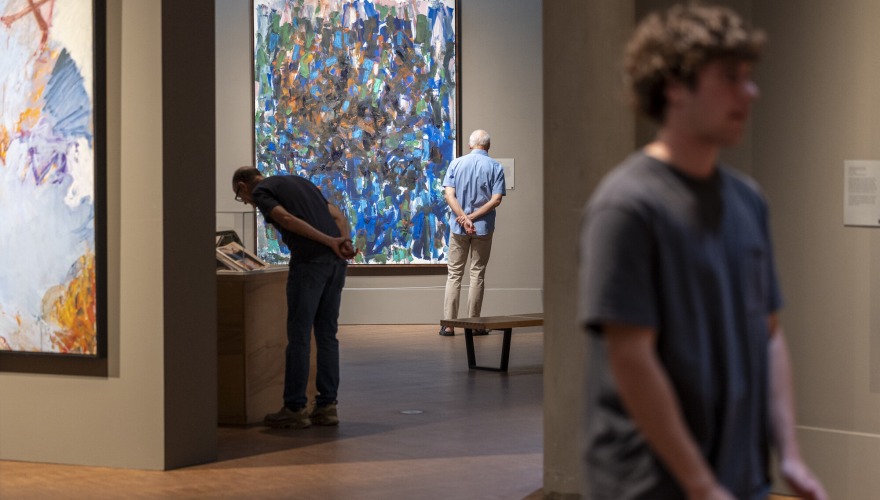 people looking at art