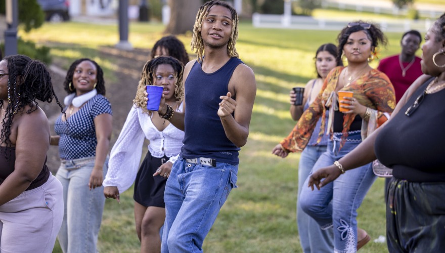 Students have fun and dance outside