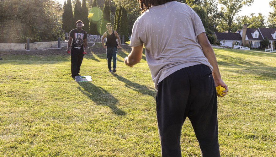 Students play corn hole