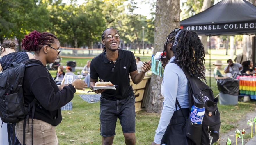 Students enjoy food and conversate outside