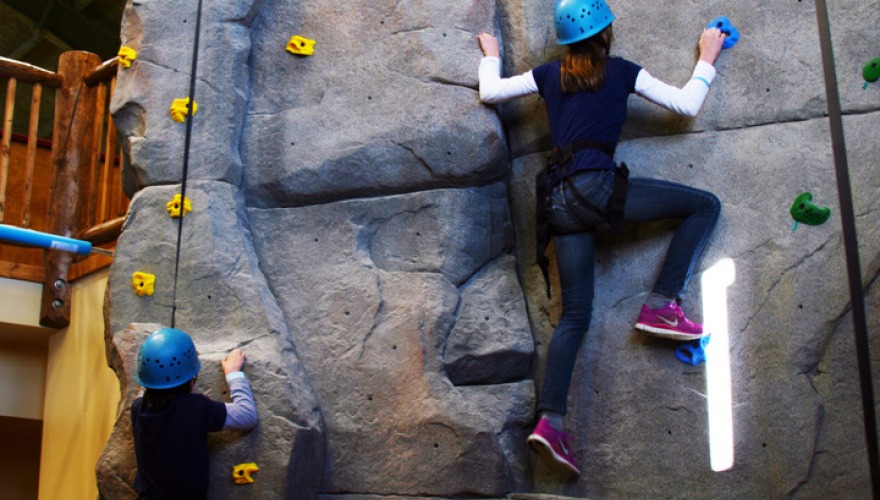 Students using climbing wall