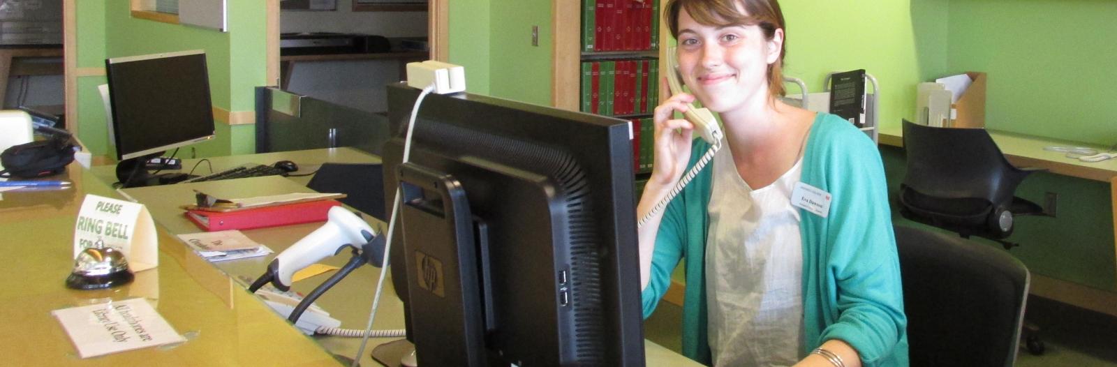 Student employee Eva Dawson staffs the circulation desk at Kistle Science Library
