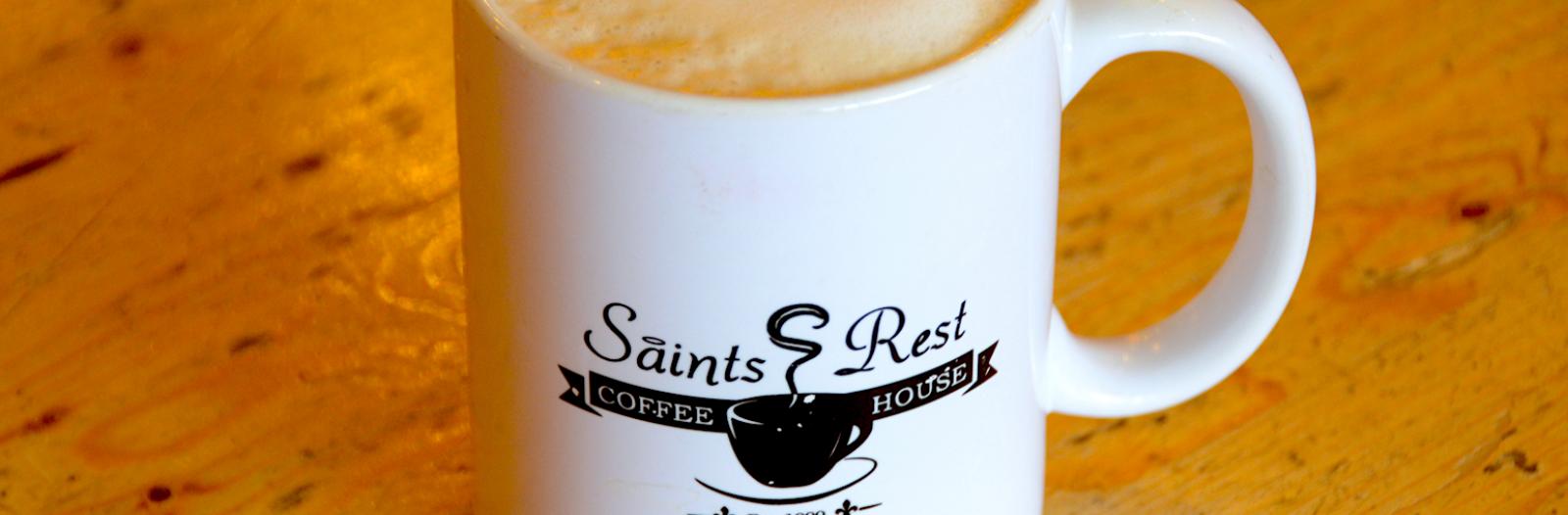 Coffee cup with Saints Rest logo