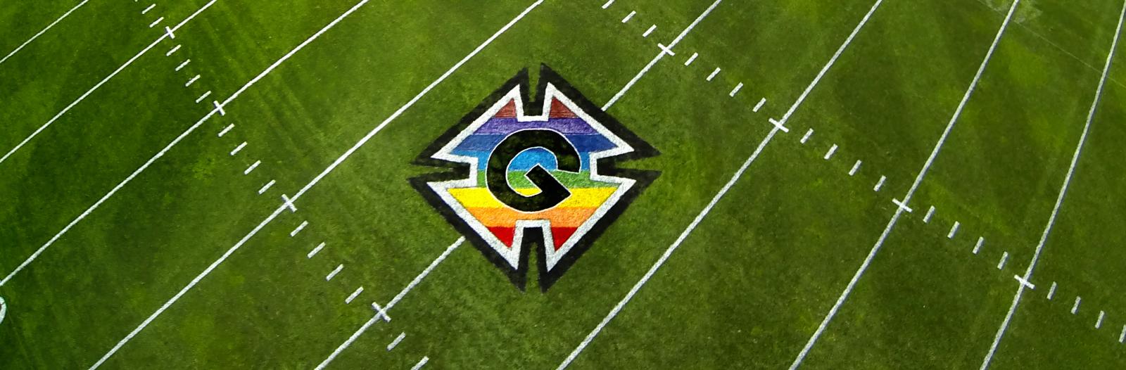 Aerial view of Rosenbloom Field with a rainbow honor G logo