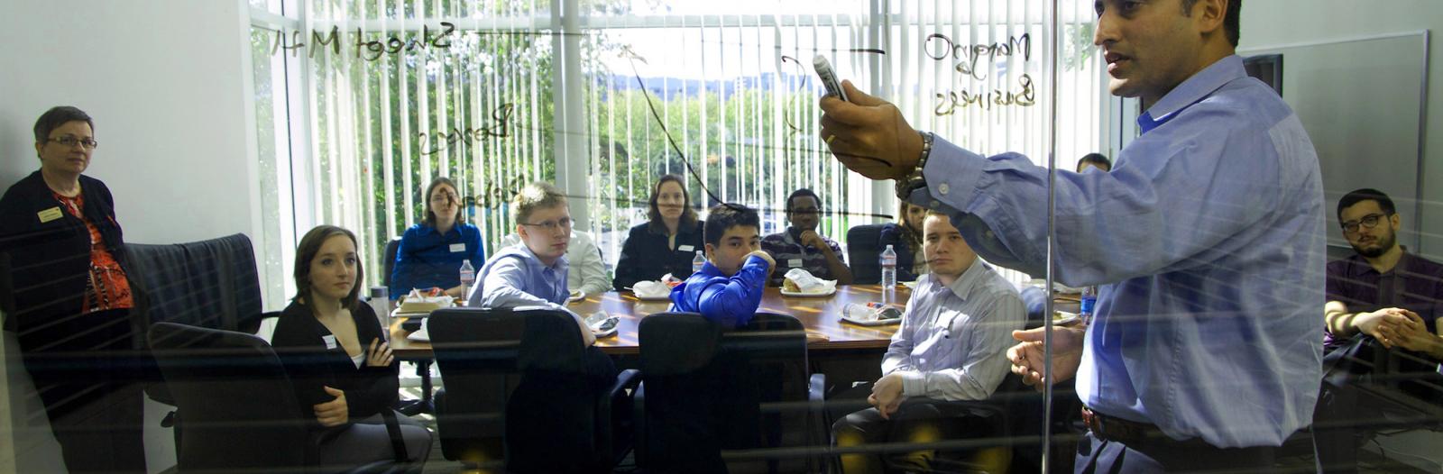 Students sit at conference table during Silicon Valley industry trek.