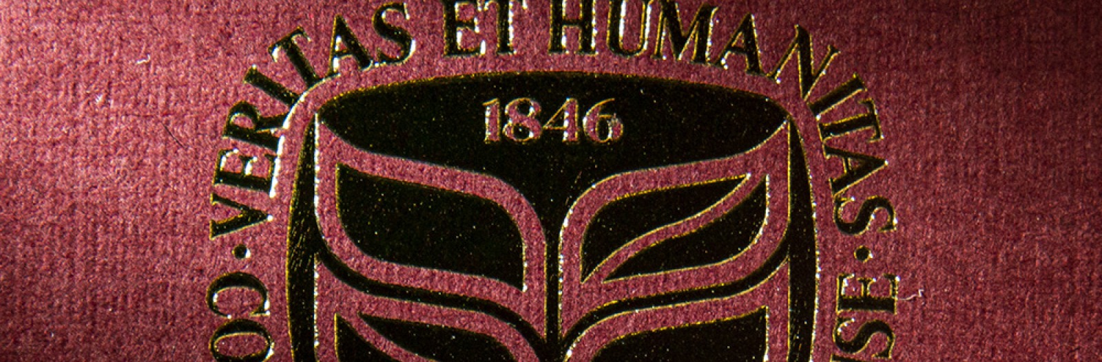 Grinnell College seal embossed in gold ink