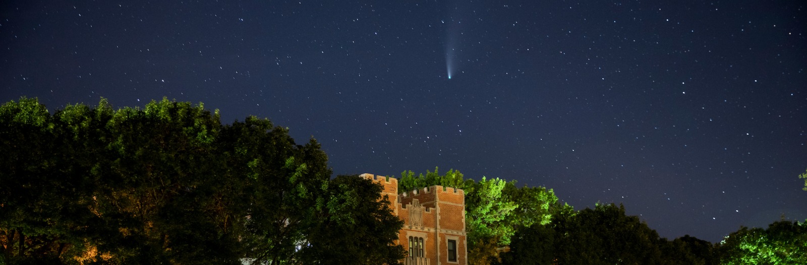 North campus with comet descending in the night sky