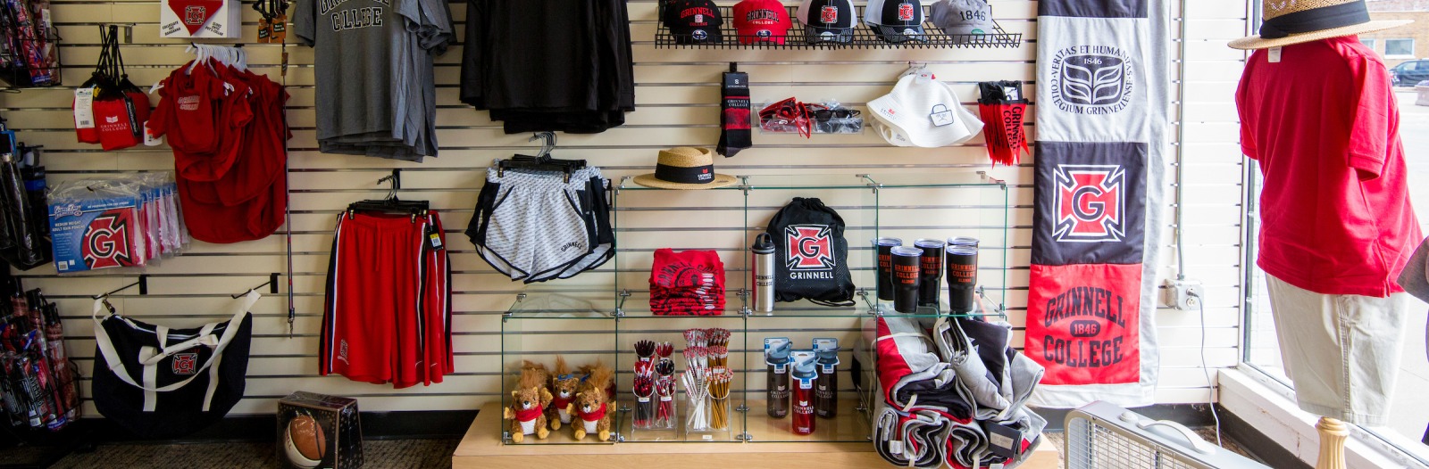 bookstore display with clothing, good branded as Grinnell College