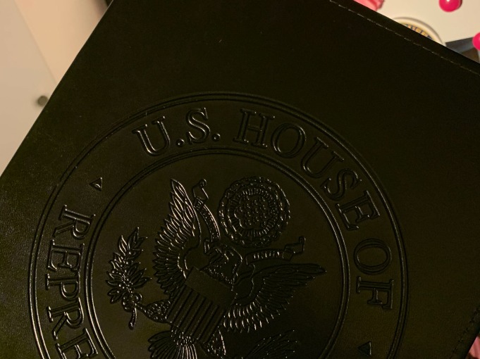 black book embossed with seal