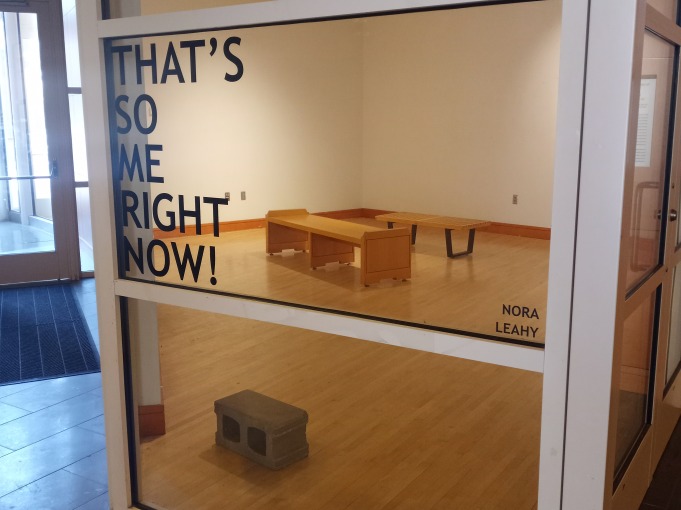 An art gallery display titled "That's So Me Right Now!" by Nora Leahy