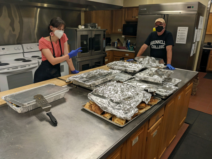 Nora and Professor Todd Armstrong are in the Global Kitchen with a lot of aluminum foiled baked goods.
