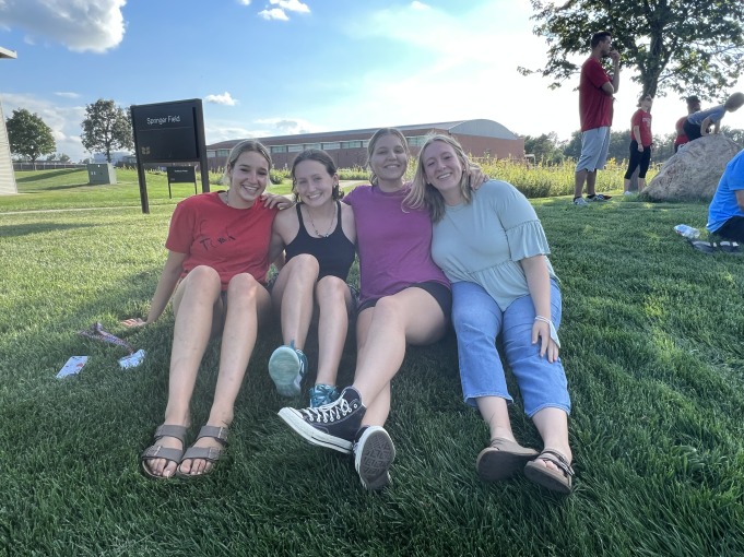 My first-year friends and I take a picture on the grass.