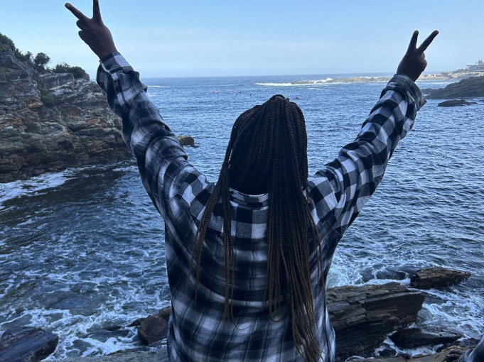 I raise my hands up and make two peace signs.