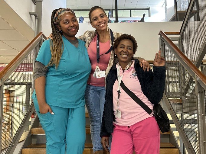 Two nurses and I take a picture on the stairs of the Women & Childcare Clinic in Cape Town, South Africa.