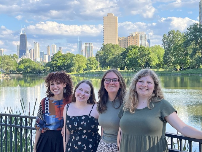 MAP group, "Dickens in the Archives" with Professor Jacobson, go to Chicago together. They smile in front of the lake.