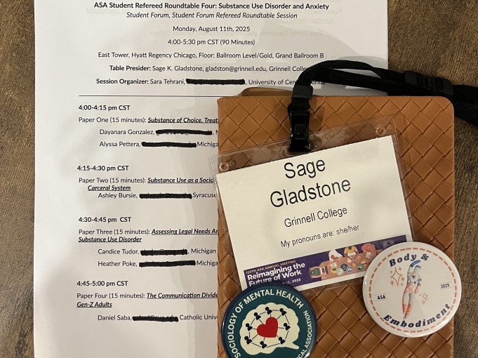 American Sociological Association nametag of Sage Gladstone, Grinnell College is placed next to a student roundtable session paper. Substance Use Disorder and Anxiety's table presider was Sage K. Gladstone of Grinnell College