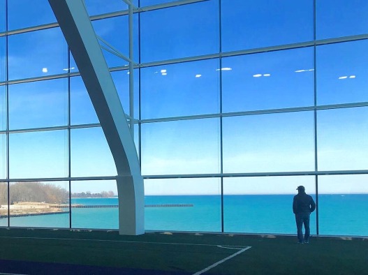 athletic facility with windows looking over ocean 