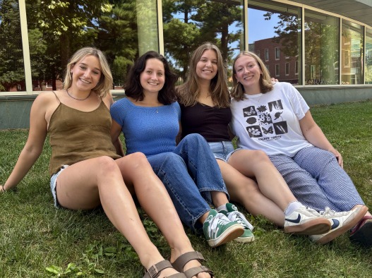 My senior friends and I take a picture on the grass.