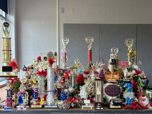 A table full of colorful trophies