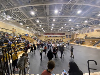 Picture of gymnasium floor with students on it 