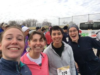 A selfie of four smilling runners