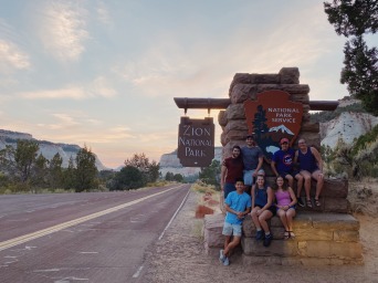 group posed at the Zion National Park sign