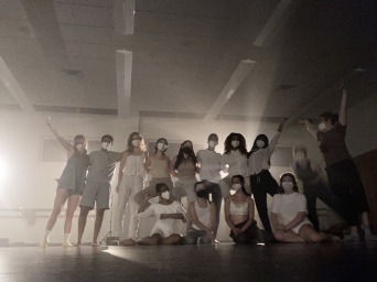 We pose in celebration after filming my music video in a dimly lit building