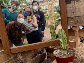 Mirror selfie with friends in a nursery and plant store