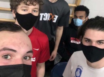 My teammates and I all wear masks during the pandemic and pose for a selfie