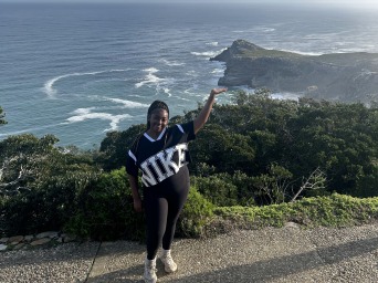 Kierra Powell overlooks the ocean and put her hand up to the southernmost part of South Africa.
