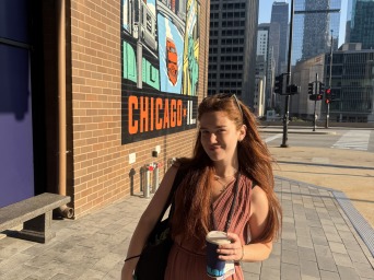 Sage next to a "Chicago, Illinois" graffiti art.