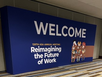 Billboard-sized wall saying "Welcome 120th ASA Annual Meeting: Reimagining the Future of Work"