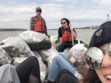 Group photo on boat with collected trash