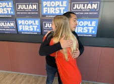 Julian receiving hug from student