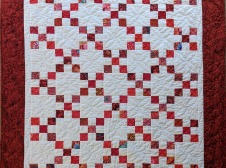 a red and white quilt
