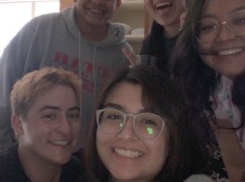 a selfie of five smiling students